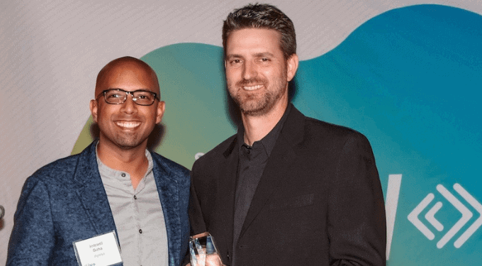 Signifyd's Indy Guha and Stance VP of direct-to-consumer Paul Zaengle, accepting Signifyd FLOW award at the Perch LA